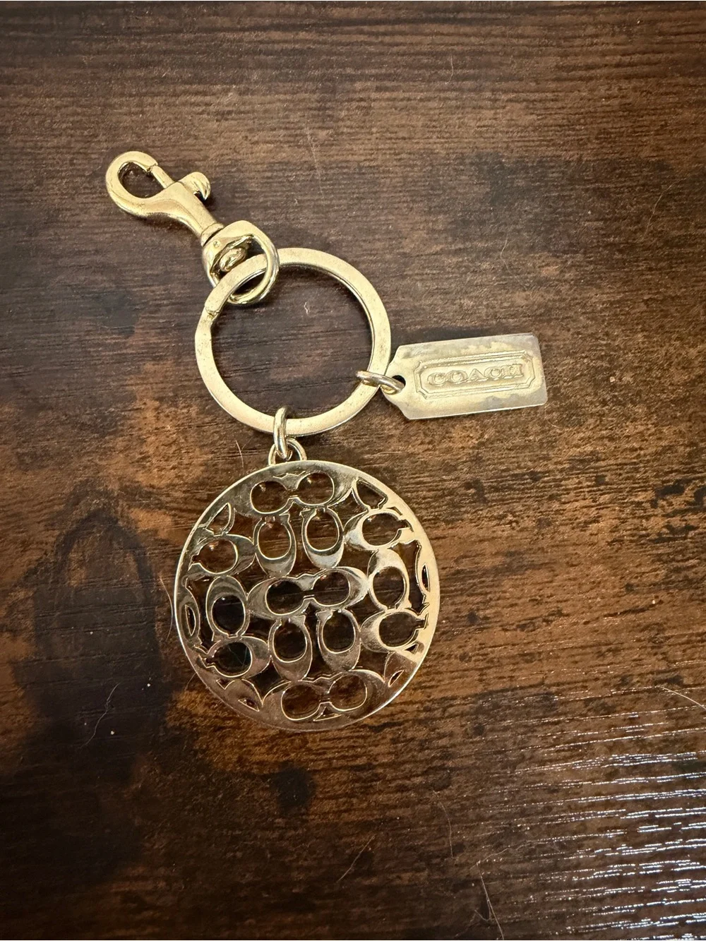 Coach Gold-Tone Round Signature Cutout Key Charm